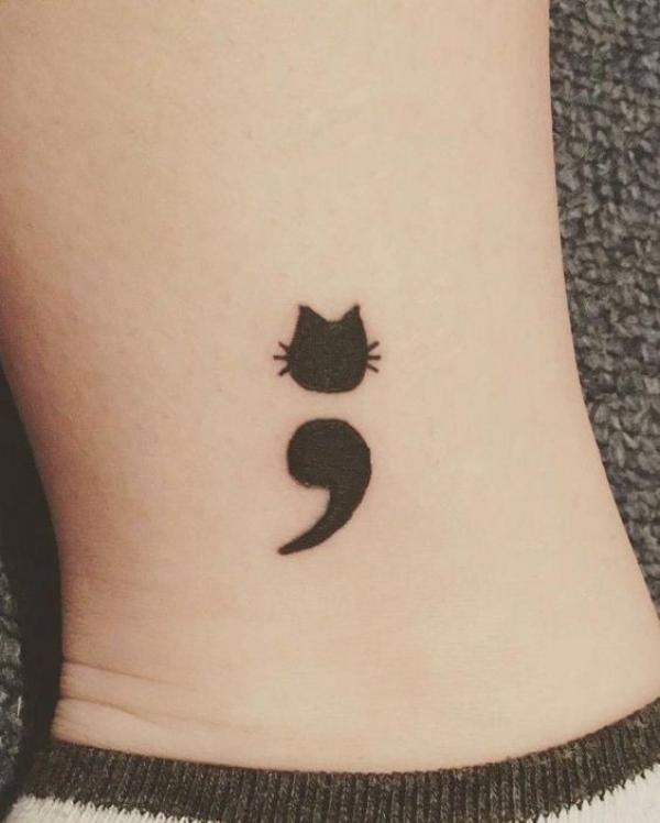 Black cat semicolon tattoo