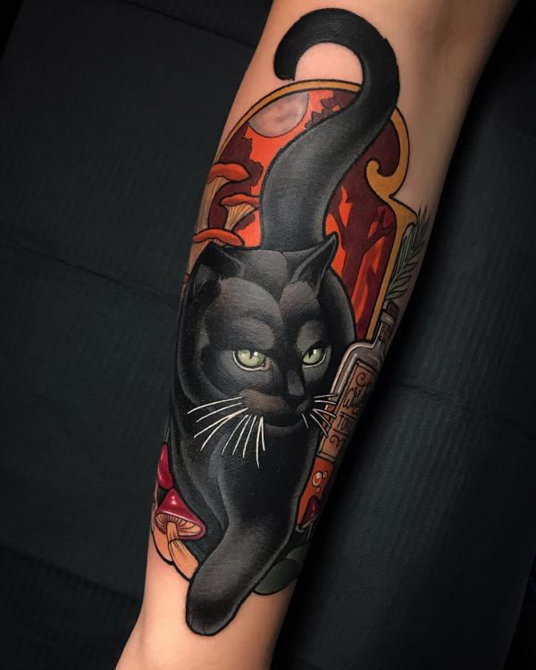Black cat with mushroom forearm tattoo