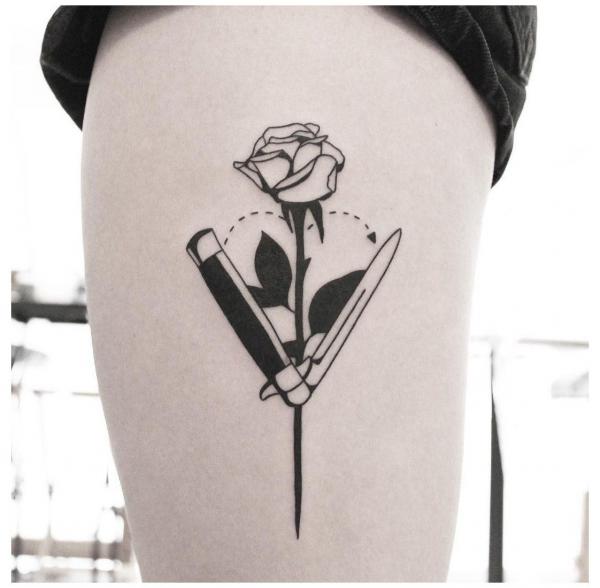 Black ink rose and fruit knife tattoo