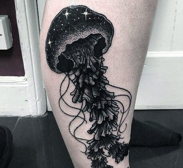 Blackwork jellyfish with stars tattoo