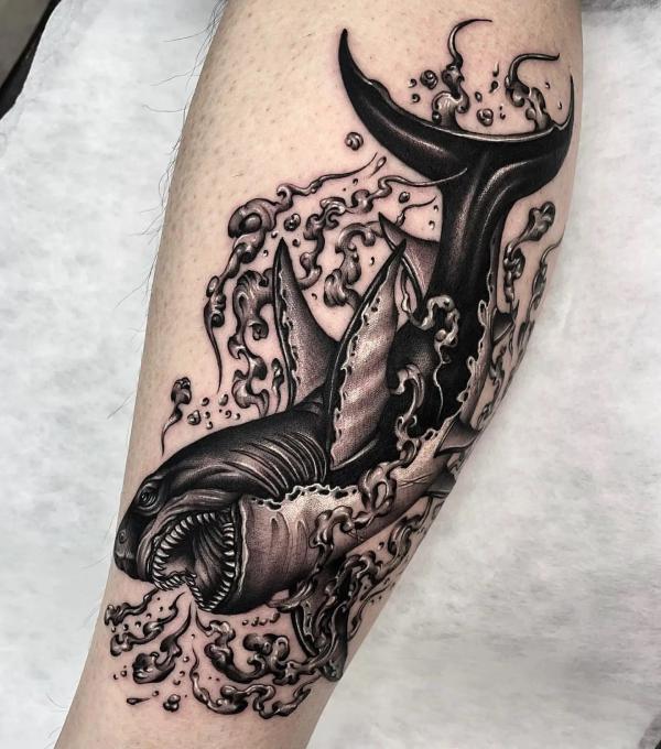 Blackwork shark and wave tattoo