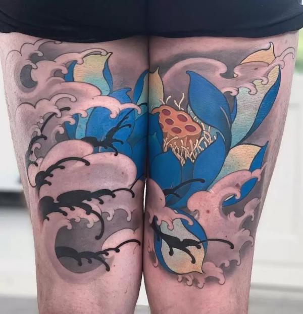 Blue Lotus and wave tattoo on back of thigh