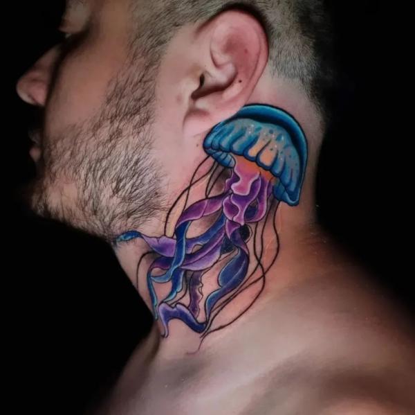 Blue and purple jellyfish neck tattoo