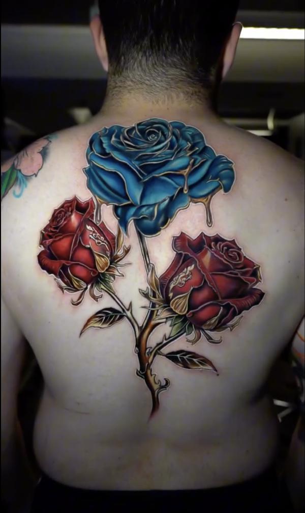 Blue and red roses with thorns tattoo