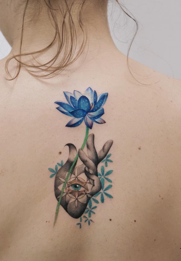 Blue lotus and a hand with eye
