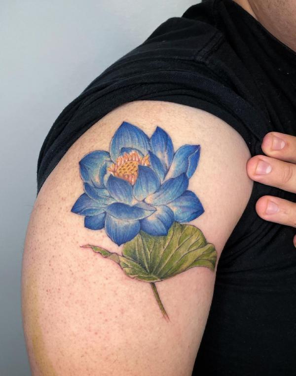 Blue lotus and leaf shoulder tattoo