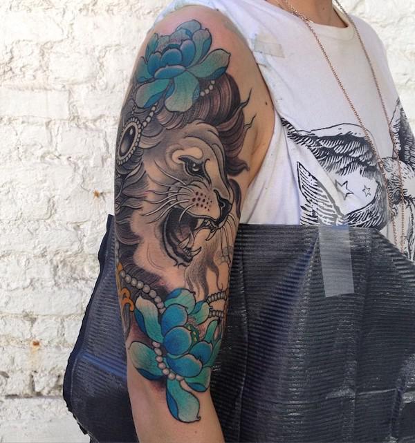 Blue lotus and lion head tattoo