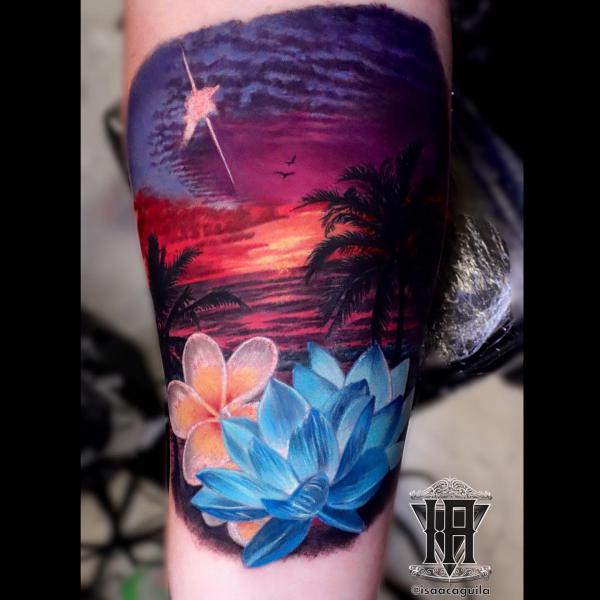 Blue lotus and palm tree sunset tattoo