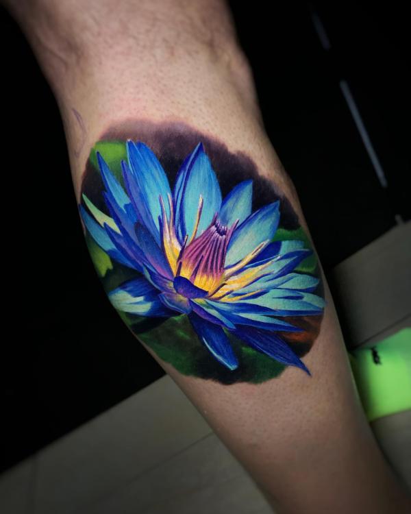 Blue lotus calf tattoo