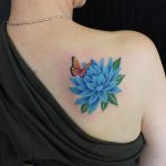 Blue lotus flower and monarch butterfly tattoo