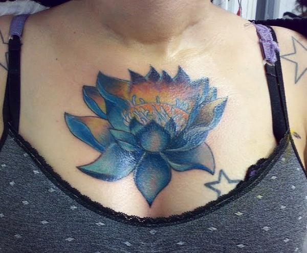 Blue lotus flower chest tattoo