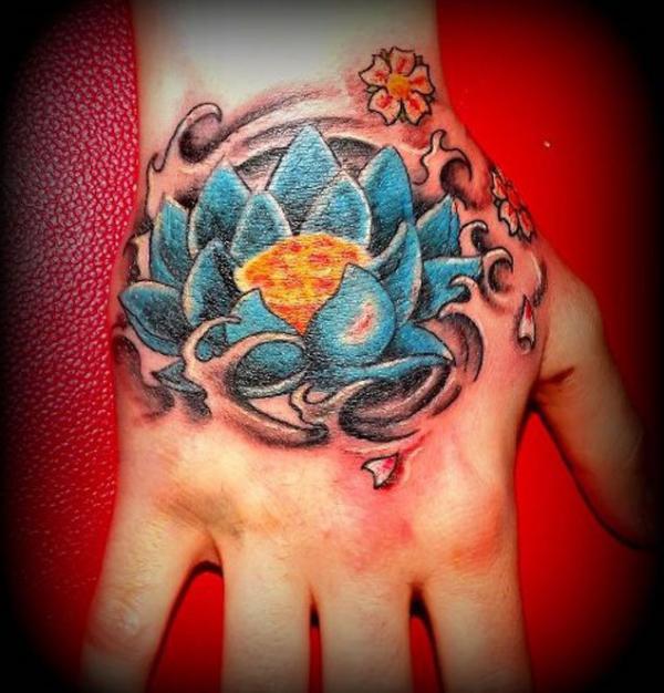 Blue lotus flower hand tattoo