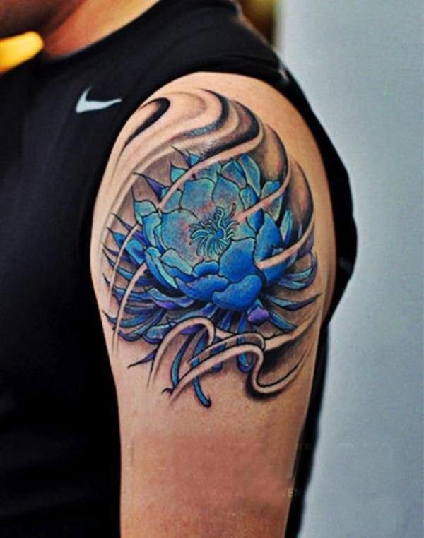 Blue lotus in swirls shoulder tattoo