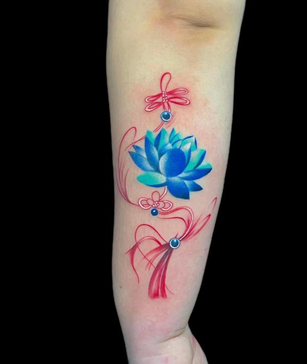 Blue lotus with tassel tattoo