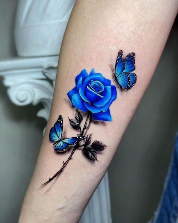 Blue rose with stem and butterflies