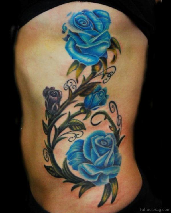 Blue rose with thorns side tattoo