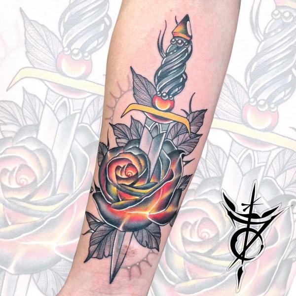 Burning rose and dagger tattoo