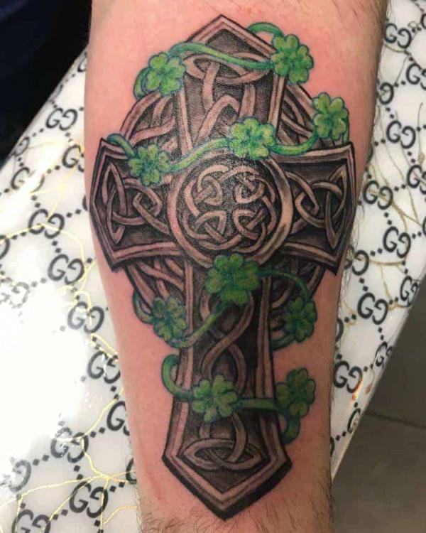Celtic cross with four leaf clovers tattoo