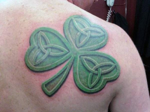 Celtic knot shamrock shoulder blade tattoo