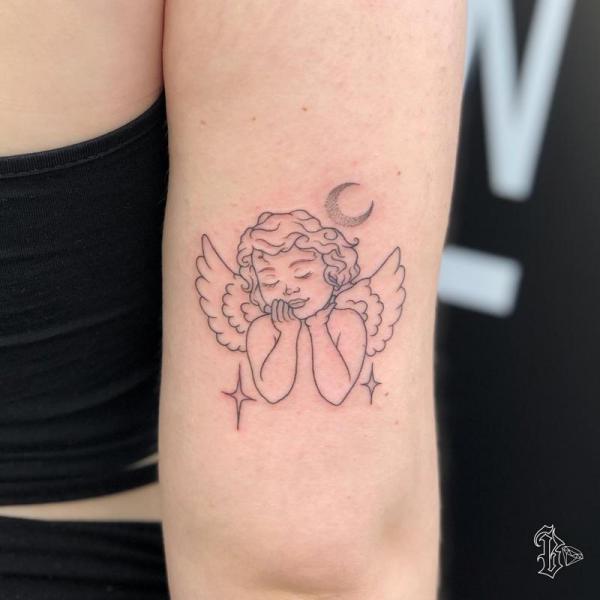 Cherub angel tattoo with moon and stars