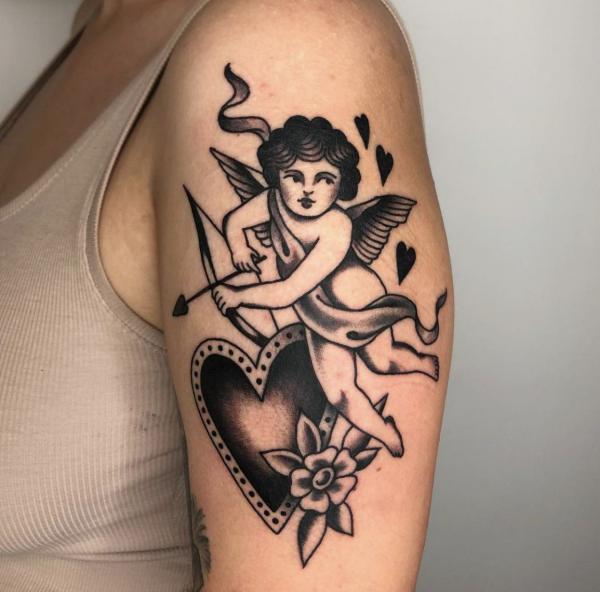 Cherub black and white traditional tattoo