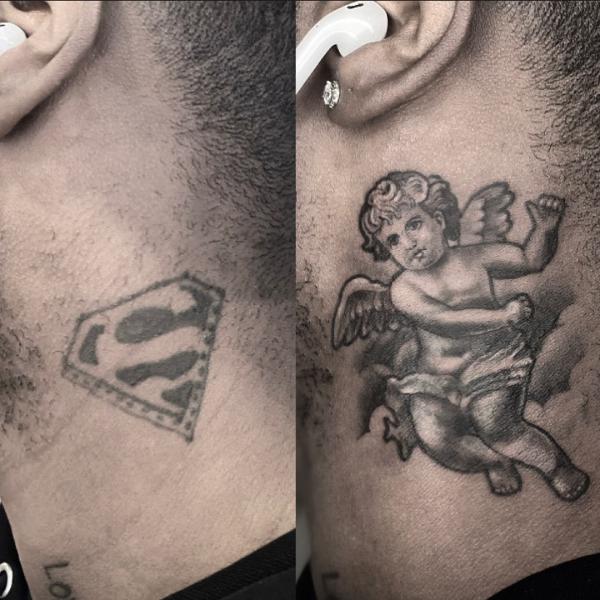 Cherub cover up tattoo under ear