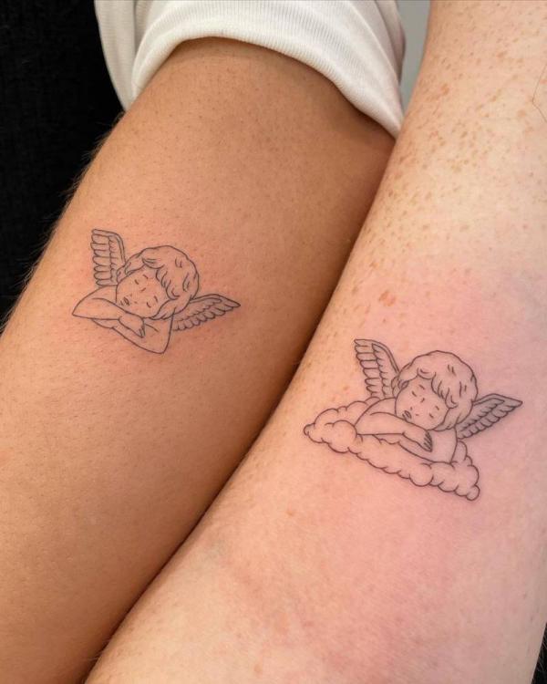 Cherub line work matching tattoos