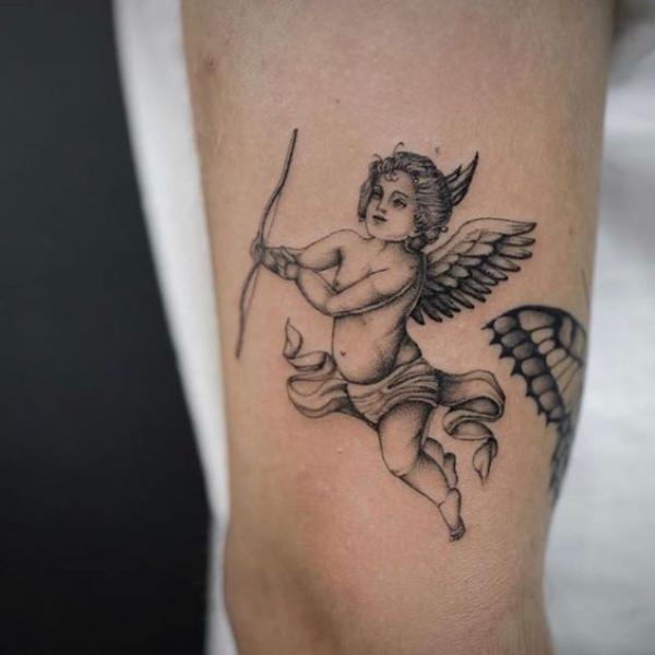 Cherub with bow tattoo