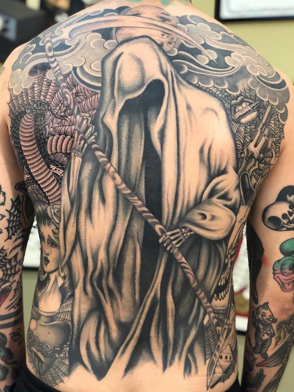 Cobra and grim reaper tattoo on back