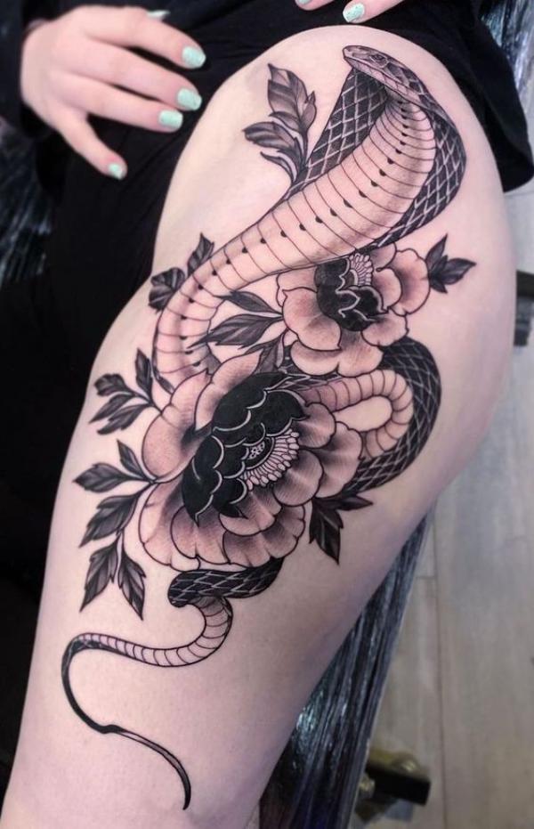 Cobra and peony tattoo on the side of hip