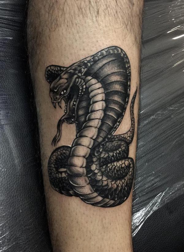 Cobra blackwork tattoo on forearm