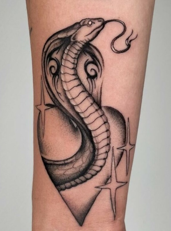 Cobra with heart and star tattoo