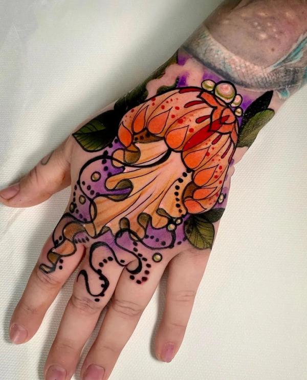 Colored Jellyfish hand tattoo
