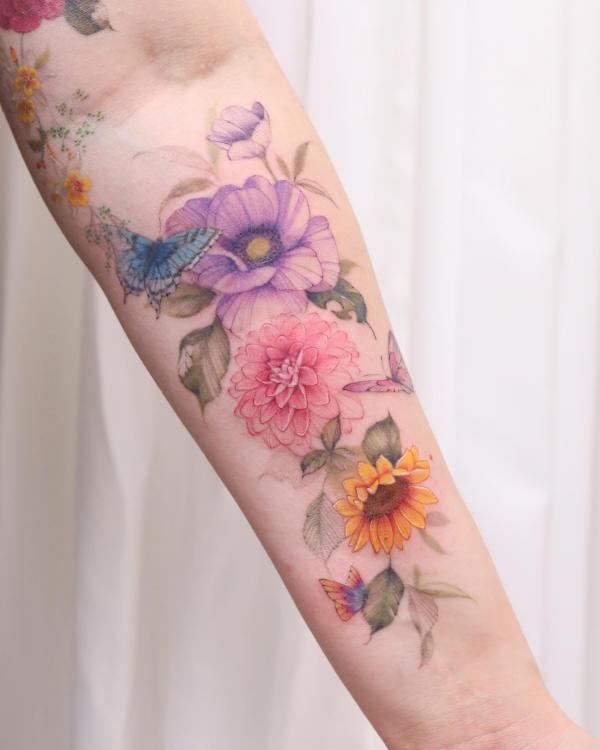 Colorful poppy dahlia and sunflower with butterfly tattoo 
