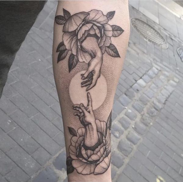 Creation of Adam calf tattoo