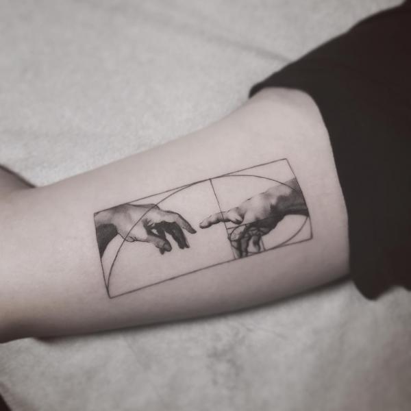 Creation of Adam with Fibonacci Sequence curve tattoo