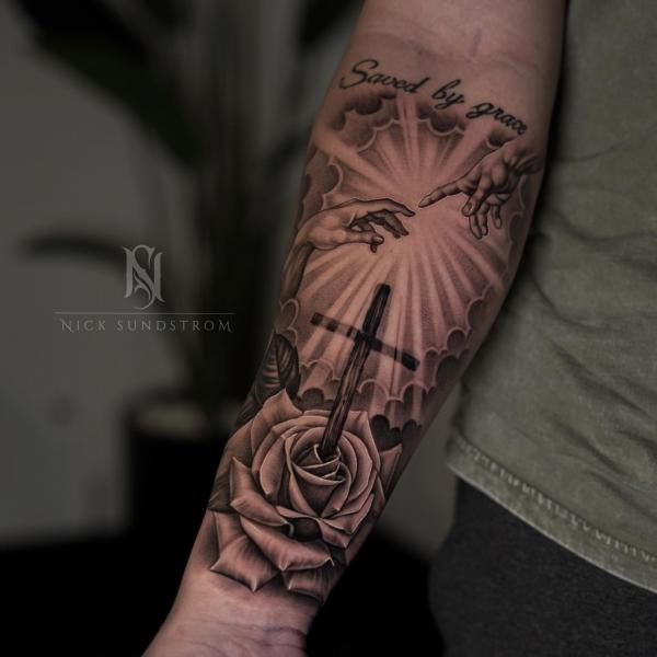 Creation of Adam with cross and rose tattoo
