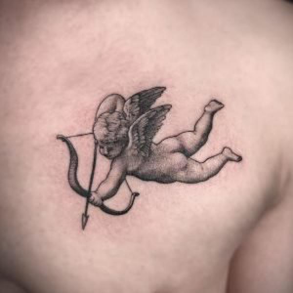 Cupid cherub dotwork tattoo