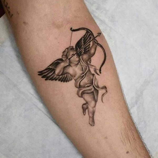 Cupid cherub forearm tattoo