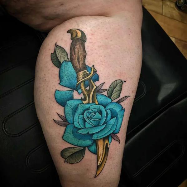 Dagger and blue rose tattoo