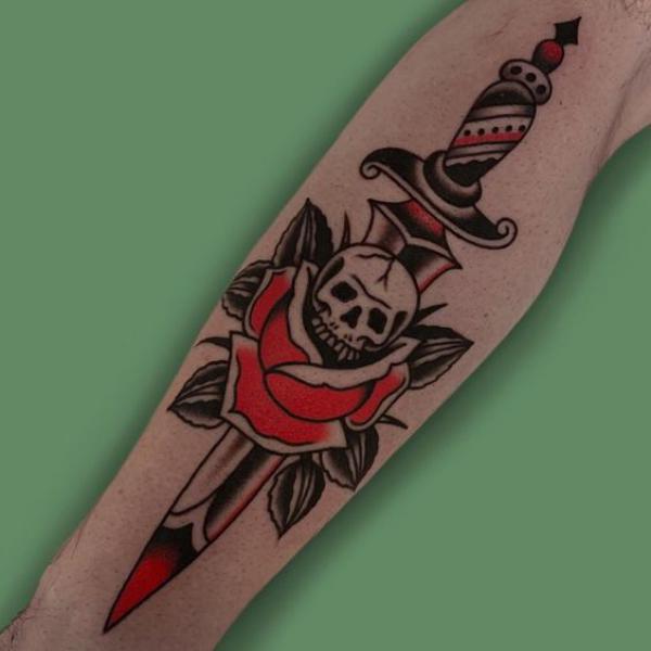 Dagger and rose with skull tattoo traditional