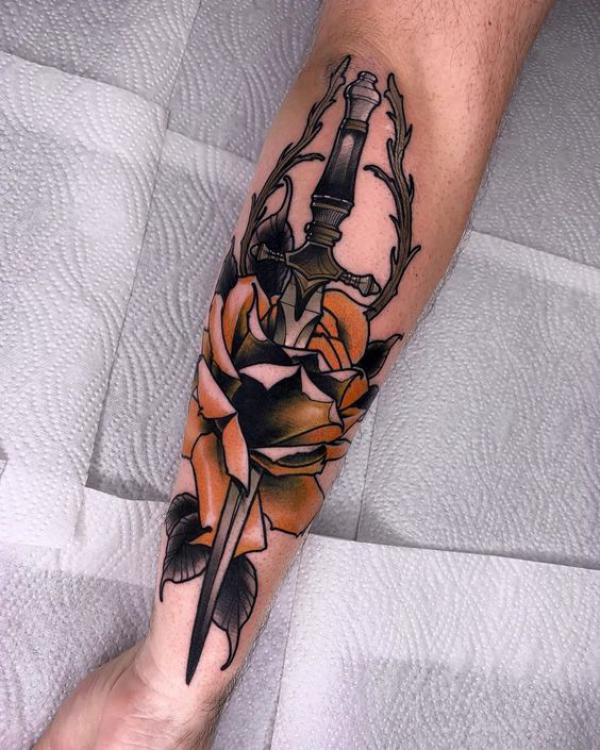 Dagger and rose with vine tattoo