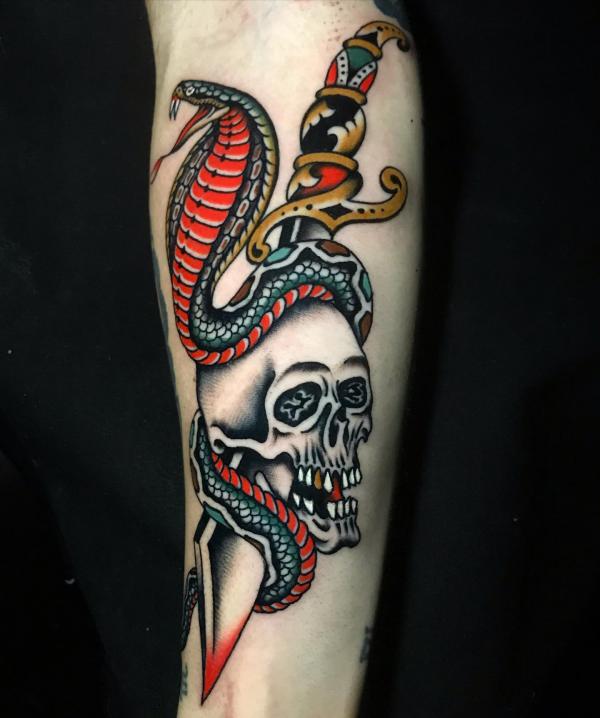 Dagger pierced skull entwined with cobra tattoo
