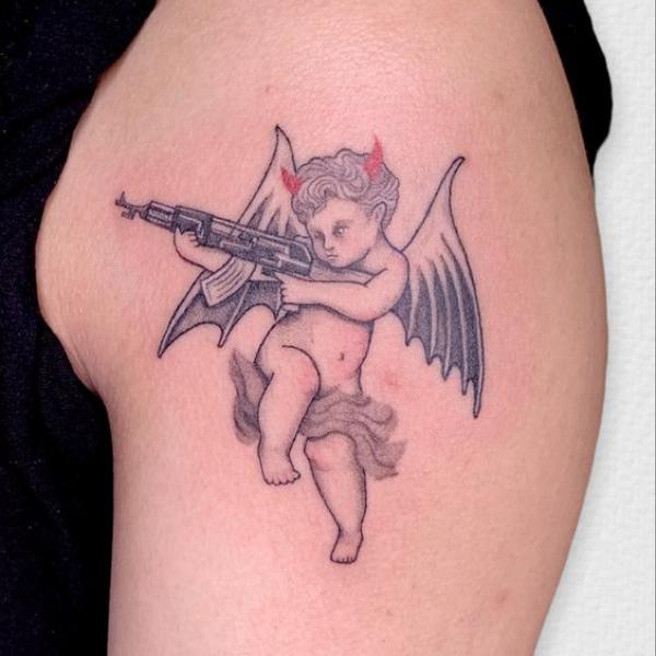 Devil cherub shooting tattoo