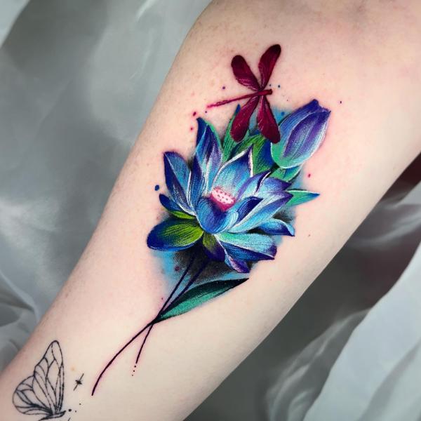 Dragonfly and blue lotus tattoo