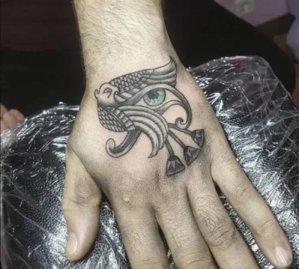 Eye of Ra and Falcon hand tattoo