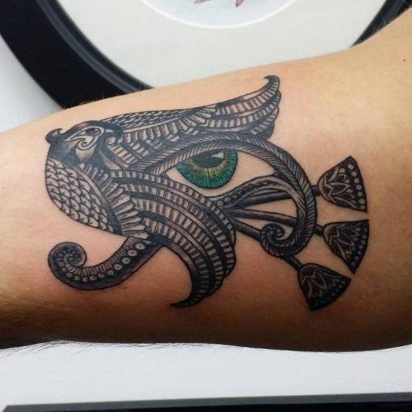 Eye of Ra and falcon tattoo