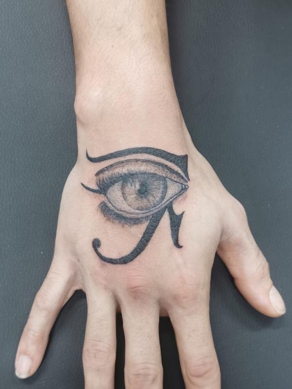 Eye of Ra with realistic eye hand tattoo