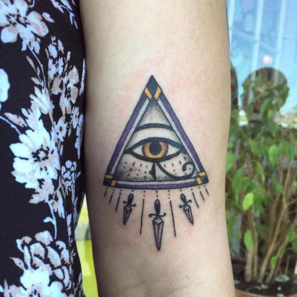 Eye of horus in triangle with daggers
