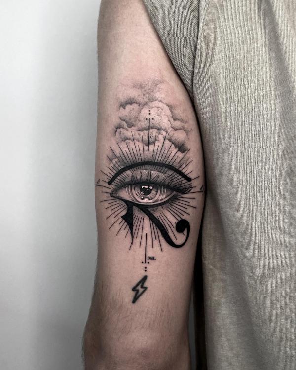Eye of horus with clouds and lightning bolt tattoo
